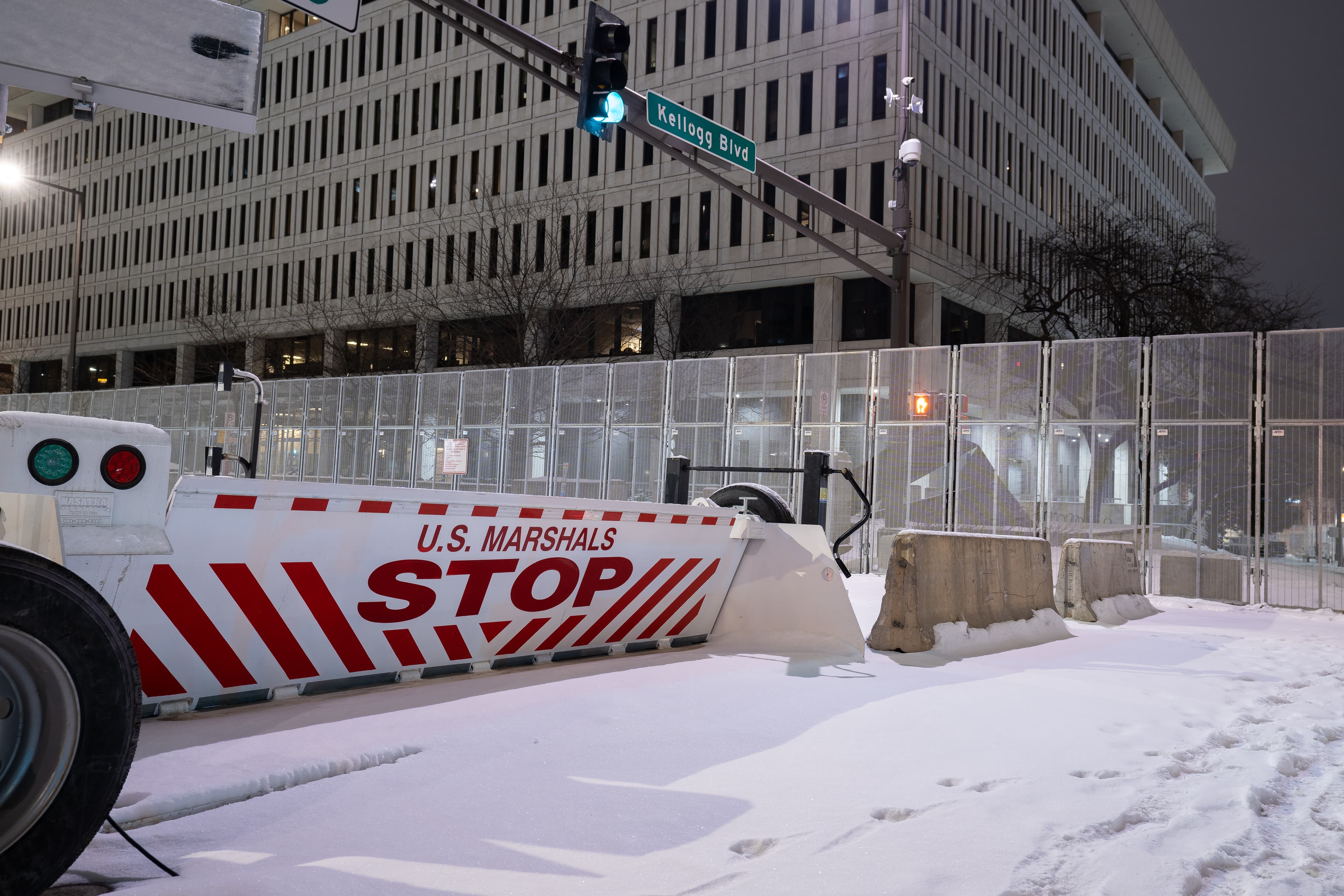 Security around the Warren E. Burger Federal Building in downtown St. Paul the night before opening statements in the trial of the officers accused of violating George Floyd's civil rights.