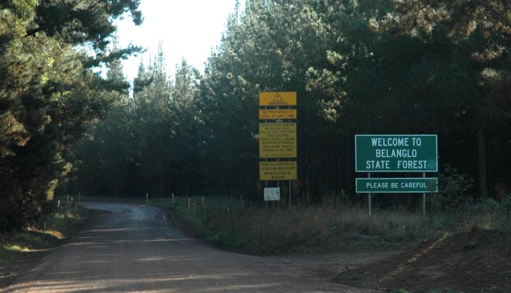 Sign at entrance to the Belanglo State Forest , off the Hume Highway in New South Wales , Australia .